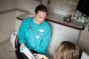 Staff member consulting with a patient
