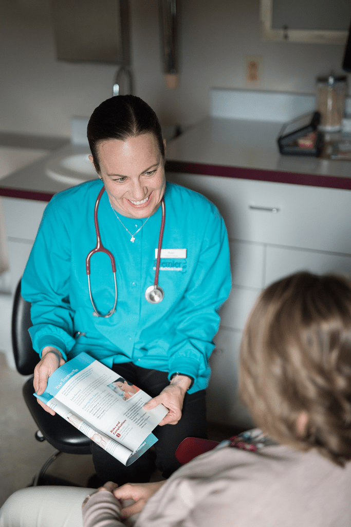 Staff member consulting with a patient